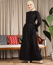 Front view of black luxe flared maxi dress – modest abaya design