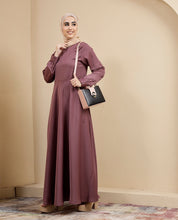 Front view of dusty peach flared maxi dress – modest abaya design